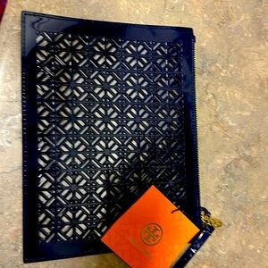 Tory Burch Navy blue Lazer cut large wristlet/ zipper pouch.